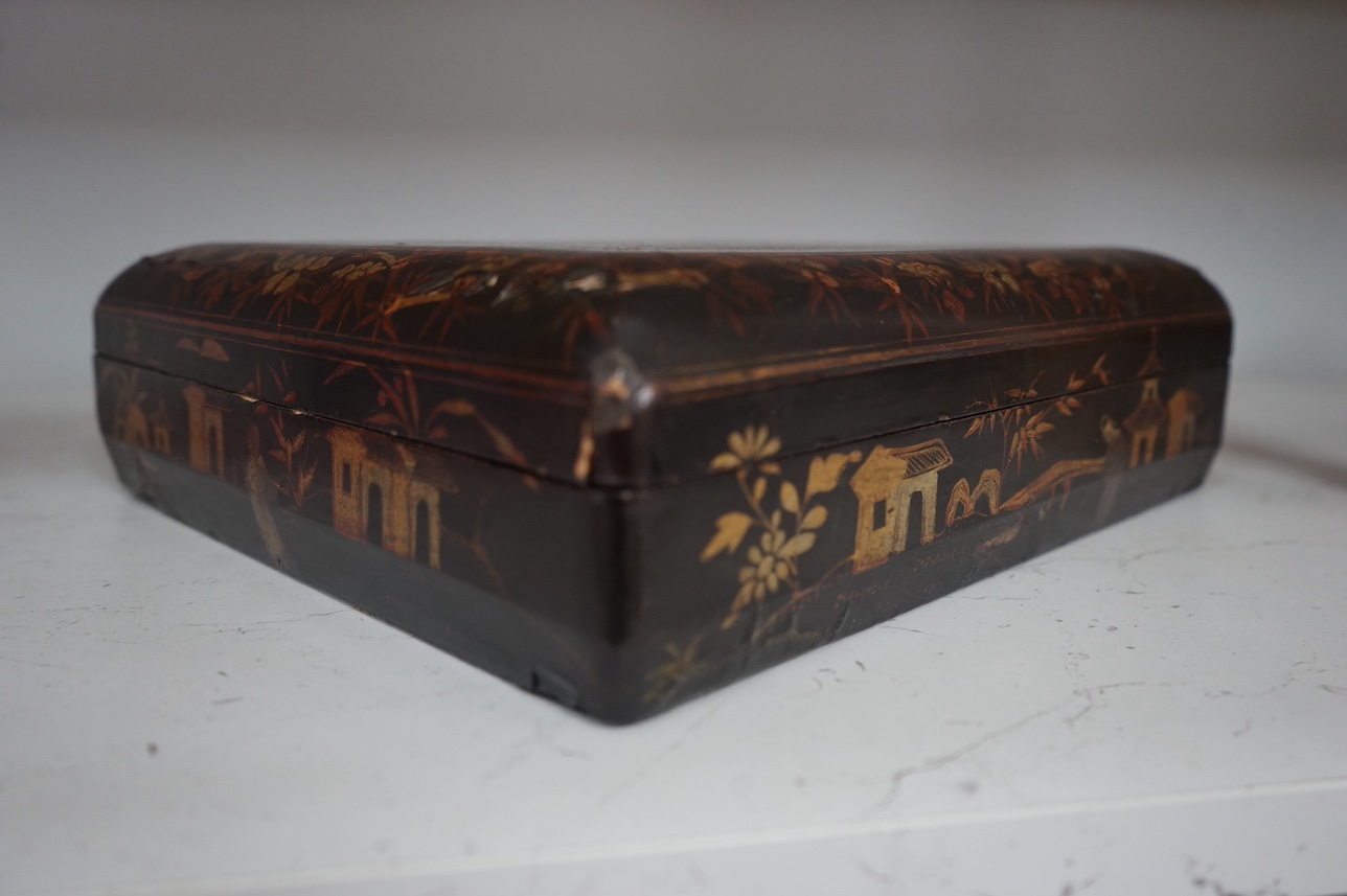 A mid 19th century Chinese gilt decorated black lacquer games box, 31cm wide. Condition - fair to good